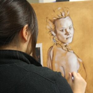 Art student sketching woman figure