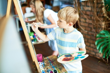 Young Child Painting in a Summer Class in MA