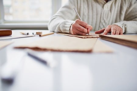 young artist drawing at a table